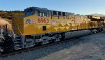 The California Setting Sun Reflects Off The Brand New UP Paint Scheme on A Brand New UP 6963 C44ACM as She Decend Cajon Pass on The UP Palmdale Cutoff at the South Canyon Siding 